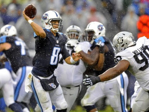 Tennessee Titans quarterback Marcus Mariota (8) attempts a pass during the second half against the Oakland Raiders at Nissan Stadium. The Raiders won 24-21. (Christopher Hanewinckel-USA TODAY Sports)