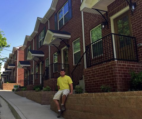 Eric Huneycutt outside completed home at 113 West Washington Street.