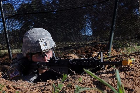 Pvt. Anthony Ennist, a light-wheeled vehicle mechanic with 584th Support Maintenance Company, 129th Combat Sustainment Support Battalion, 101st Airborne Division (Air Assault) Sustainment Brigade, 101st Abn. Div., pulls guard in his foxhole, Sept. 27, 2016, during his company field training exercise on Fort Campbell, Ky. (Pfc. Tyler Owen/ 129th Combat Sustainment Support Battalion UPAR) 