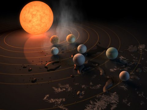 The TRAPPIST-1 star, an ultra-cool dwarf, has seven Earth-size planets orbiting it. This artist's concept appeared on the cover of the journal Nature in Feb. 23, 2017 announcing new results about the system. (NASA/JPL-Caltech)