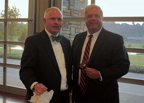 2015-16 Chamber Chairman Tommy Bates and 2016-17 Chairman Sidney Johnson pass the ceremonial gavel during the exchange of leadership at the Chamber’s 2016 Annual Dinner & Gala.