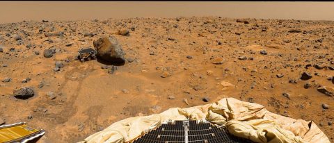 This portion of a classic 1997 panorama from the IMP camera on the mast of NASA's Mars Pathfinder lander includes "Twin Peaks" on the horizon, and the Sojourner rover next to a rock called "Yogi." (NASA/JPL)