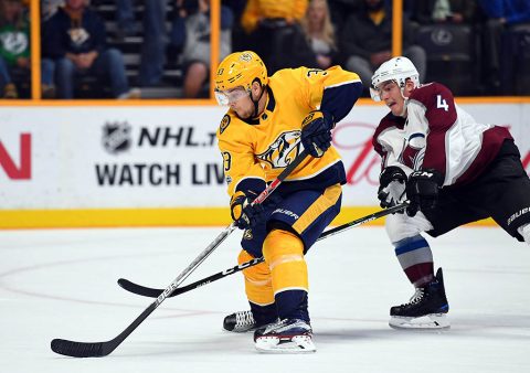 Nashville Predators left wing Viktor Arvidsson (33) works around Colorado Avalanche defenseman Tyson Barrie (4) for a short handed shot during the first period at Bridgestone Arena. (Christopher Hanewinckel-USA TODAY Sports)