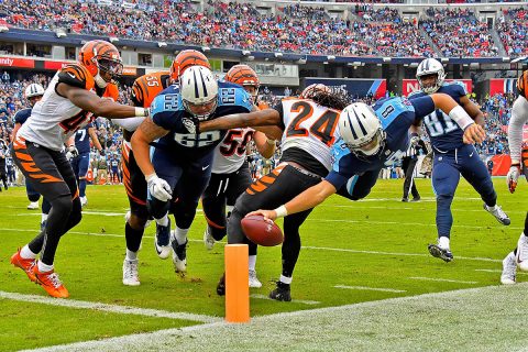 Tennessee Titans quarterback Marcus Mariota (8) is knocked out of bounds by Cincinnati Bengals cornerback Adam Jones (24) as he dives for the goal line during the first half at Nissan Stadium. (Jim Brown-USA TODAY Sports)