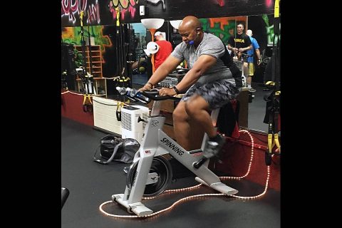 CSM Jerome Wren takes a spin on his exercise bike during a routine workout. (CSM Jerome Wren) 