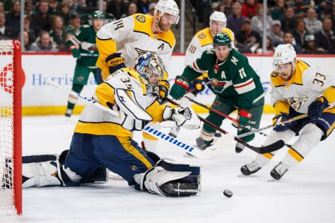 Mar 24, 2018; Saint Paul, MN, USA; Nashville Predators goalie Pekka Rinne (35) makes a save in the second period against Minnesota Wild forward Zach Parise (11) at Xcel Energy Center. Mandatory Credit: Brad Rempel-USA TODAY Sports