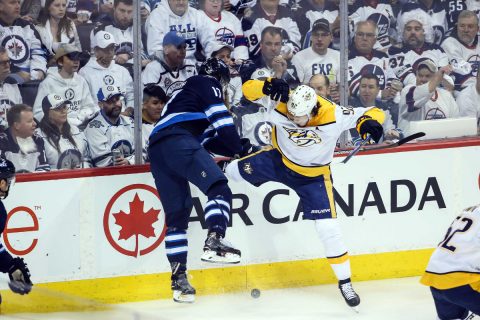  Winnipeg Jets forward Adam Lowry (17) bodies Nashville Predators forward Ryan Johansen (92) during the first period in game three of the second round of the 2018 Stanley Cup Playoffs at Bell MTS Place. (Terrence Lee-USA TODAY Sports)