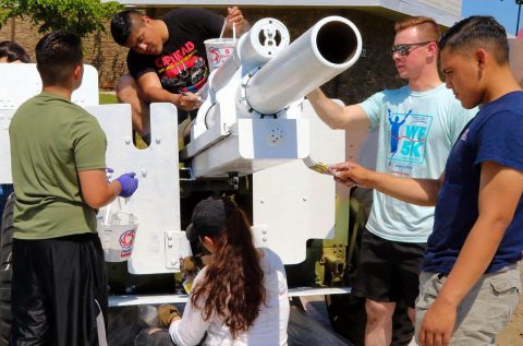 Soldiers of the 101st Airborne Division (Air Assault) prime a 155mm M114 howitzer for repainting, 29 June, at the Don F. Pratt Memorial Museum on Fort Campbell, Kentucky.  (Pfc. Lynnwood Thomas, 40th Public Affairs Detachment) 