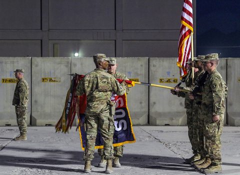 As the sun set, the brigade command team, consisting of Col. Stanley Sliwinski, commander of the 101st Airborne (Air Assault) Sustainment Brigade and CSM Anthony B. McAdoo, command sergeant major for 101st Sustainment Brigade, ceremoniously uncased the colors, marking the beginning of the brigade’s fifth deployment to Afghanistan. (SSG Caitlyn Byrne, 101st SBDE PAO) 