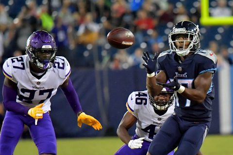 Tennessee Titans wide receiver Cameron Batson (17) catches a pass for a first down against Minnesota Vikings safety Jayron Kearse (27) and Vikings cornerback Trevon Mathis (46) during the second half at Nissan Stadium.(Jim Brown-USA TODAY Sports)