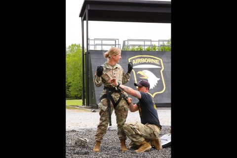 Capt. Lisa Kasper, an Emergency Room Nurse assigned to 3rd Brigade Combat Team, 101st Airborne Division (Air Assault), is inspected by Sgt. Kyle York, an instructor at the Sabalauski Air Assault School at Fort Campbell, KY, May 1st. (U.S. Army photo by Maj. John J. Moore) 