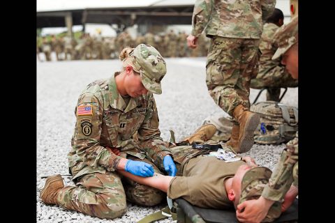 Capt. Lisa Kasper, an Emergency Room Nurse assigned to 3rd Brigade Combat Team, 101st Airborne Division (Air Assault), inserts an intravenous needle into a patient during a training exercise at Fort Campbell, KY, May 1st. (U.S. Army photo by Maj. John J. Moore) 