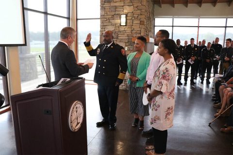 Clarksville Mayor Joe Pitts issues the oath of office to Freddie D. Montgomery Jr., Clarksville Fire Rescue’s 17th Fire Chief, during the swearing in ceremony Thursday at Freedom Point. (Samantha Stoffregen)