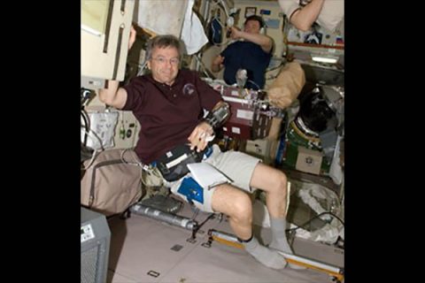 Former Canadian Astronaut Robert “Bob” Thirsk wearing device which continuously measures blood pressure. (NASA)