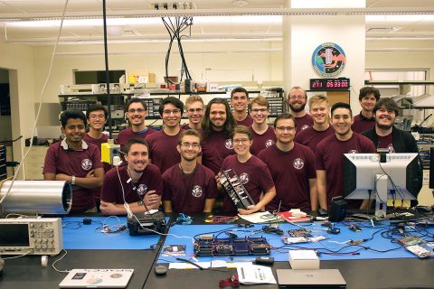 Montana State University students with RadSat-u CubeSat. (NASA)