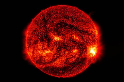 An image of the Sun captured by NASA's Solar Dynamics Observatory on Oct. 27, 2014. It shows a large active region (bottom right) erupting in a flare. (NASA/GSFC/SDO)