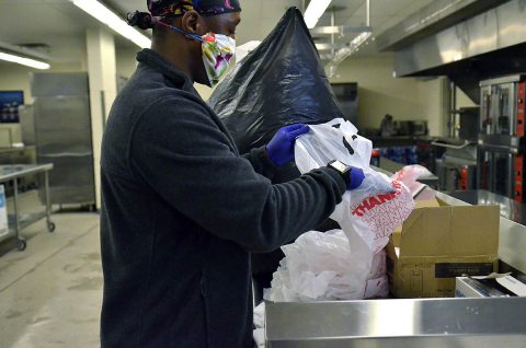 Sergeant Tyrus Mantroy, 1st Squadron, 75th Cavalry Regiment, 2nd Brigade Combat Team, 101st Airborne Division (Air Assault), helps to organize bags for free grab-and-go breakfast and lunch meals for children ages 18 and younger, April 16, at Barsanti Elementary School. Mantroy is a Better Opportunities for Single Soldiers volunteer. The free food distribution is part of the Fort Campbell Child Nutrition Program. (Emily LaForme, Fort Campbell Courier)