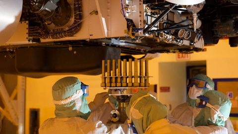 A tray holding 39 sample tubes - each protected in a gold-colored sheath - is installed in NASA's Perseverance rover in this picture taken at the agency's Kennedy Space Center on May 21st, 2020. (NASA/JPL-Caltech/KSC)