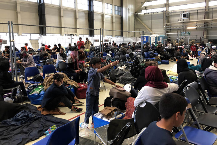 A departure lounge is set up in a C-5 hangar at Ramstein Air Base, Germany for Afghan refugees on their way to America, September 10th, 2021. (Jim Garamone, DOD)