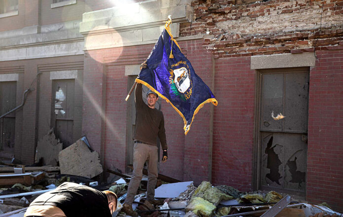 Kentucky state flag rescued from the rubble of the courthouse in Mayfield, KY. (Spc. Brett Hornback, 133rd Mobile Public Affairs Detachment)