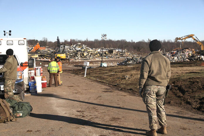 Army Guardsmen with the 301st Chemical Battalion and Air Guardsmen with the 123rd Airlift Wing continue search and rescue missions in Mayfield, KY on December 12th, 2021. (Spc. Brett Hornback, 133rd Mobile Public Affairs Detachment)