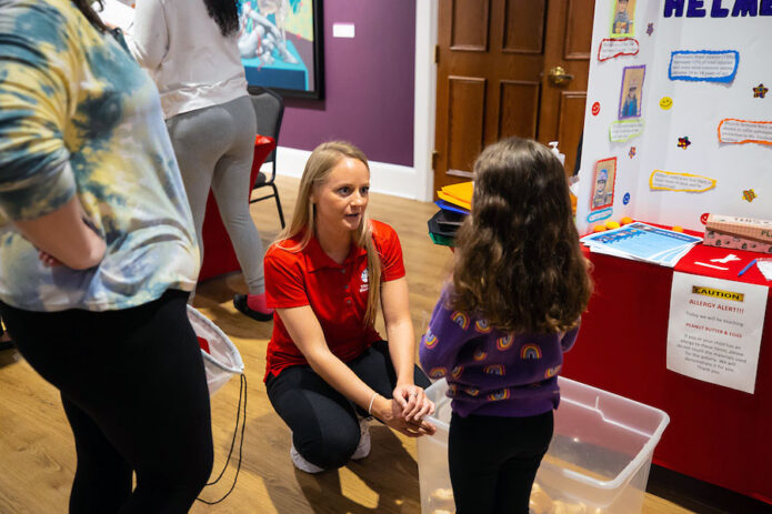 Samantha Shemwell works at the helmet safety booth. (APSU)