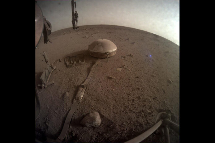 This is one of the last images ever taken by NASA’s InSight Mars lander. Captured on December 11th, 2022, the 1,436th Martian day, or sol, of the mission, it shows InSight’s seismometer on the Red Planet’s surface. (NASA/JPL-Caltech)