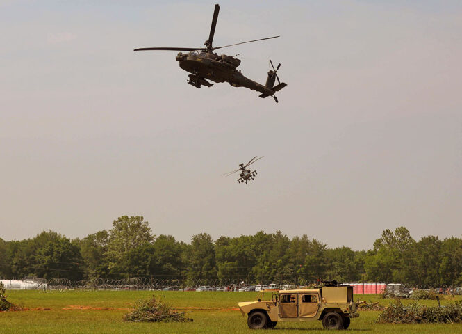 AH-64 “Apaches” assigned to the 101st Airborne Division (Air Assault) do an assault flyover simulation during the Week of the Eagles Air Assault Demonstration on Fort Campbell, KY, May 21st, 2023. The theme for this year’s Week of the Eagles event is “Celebrating 80 years of excellence”. (Pfc. Matthew Wantroba, 101st Airborne Division)