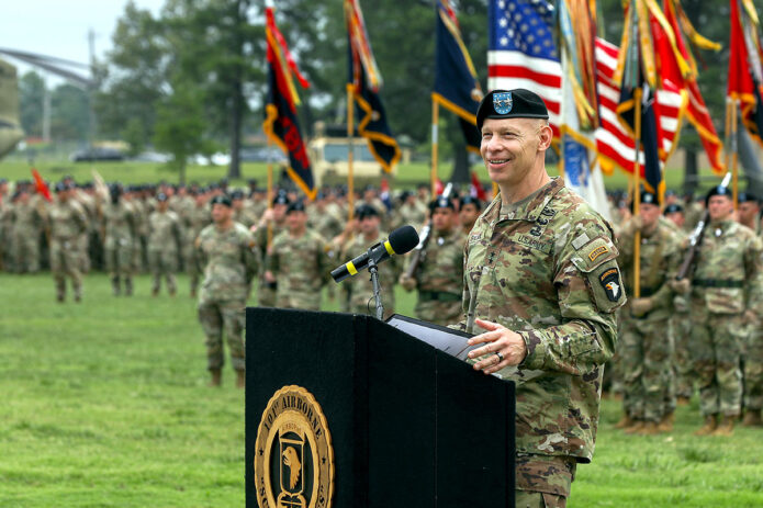 Maj. Gen. Brett Sylvia, incoming commander of the 101st Airborne Division (Air Assault), delivers remarks during the division Change of Command ceremony at Fort Campbell, Ky., July 20, 2023. Sylvia thanked McGee for his professionalism and commitment during his time leading the division, and said he is honored and ready to start his new position as division commanding general. (Sgt. Andrea Notter, 101st Airborne Division)