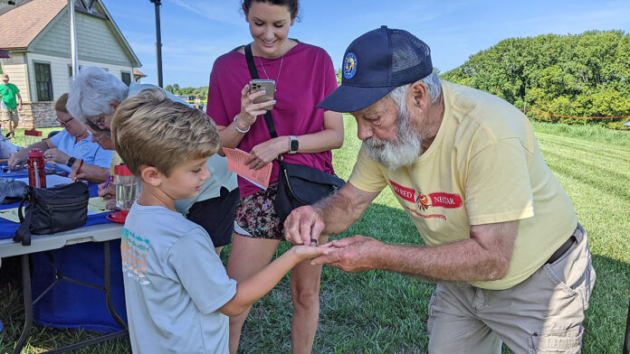 Luke Seratt gets to release a ruby throated hummingbird with banding volunteer Mitz Bailey as his mother, Meagan Seratt takes photos. The refuge will once again hold their family friendly hummingbird banding event Saturday, August 12th from 8:00am - 3:00pm with a pause for a program at 11:00am. The Friends of Tennessee NWR will host the event and offer lunch for sale and a chance to 