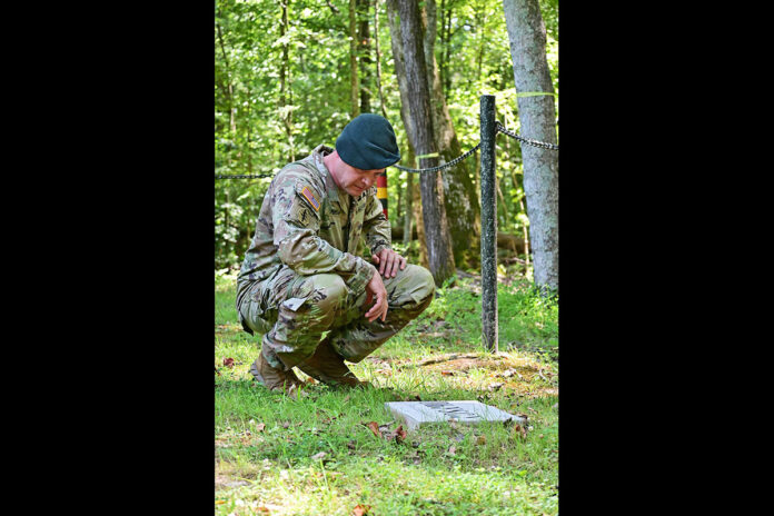 Fort Campbell Garrison Commander Col. Andrew Q. Jordan, visits the Fort Campbell German POW Cemetery to pay his respects to the more than 50 partial Native American remains, July 28th. The remains were reinterred in the German POW Cemetery July 20th, 2021. Jordan, a member of the Cherokee Nation, visited the cemetery as part of his final tour as the garrison commander. (Kayla Cosby, Fort Campbell Public Affairs Office)