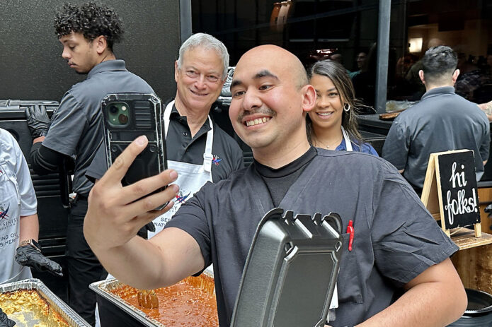 U.S. Army Combat Medical Specialist Spc. Andrew Ruiz, assigned to BACH’s Emergency Center takes a selfie with actor Gary Sinise during a Serving Heroes Event at the hospital on Fort Campbell, Nov. 9. Sinise served more than 350 free meals during his hour-long visit to show his appreciation for healthcare professionals in the Military Health System.