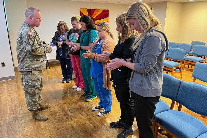 BACH's Chaplain, Maj. Jeremiah Catlin, 531st Hospital Center's Chaplain, Capt. Sarah Caine, and Soldier Recovery Unit Chaplain Capt. Fortune Aisabokhae performed the Blessing of the Hands ceremony for nurses and support staff in the hospital Chapel, at Byrd and LaPointe Clinics, at the SRU, and in BACH clinics and departments Monday, May 6. This tradition acknowledges the sacred role of nurses and healthcare support personnel - and their hands - in patient care. (Russell Tafuri, Blanchfield Army Community Hospital)
