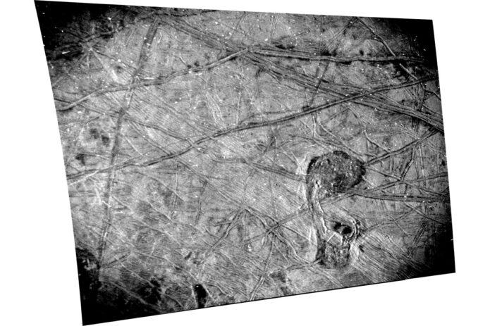 This black-and-white image of Europa’s surface was taken by the Stellar Reference Unit (SRU) aboard NASA’s Juno spacecraft during the Sept. 29, 2022, flyby. The chaos feature nicknamed “the Platypus” is seen in the lower right corner. (NASA/JPL-Caltech/SwRI)