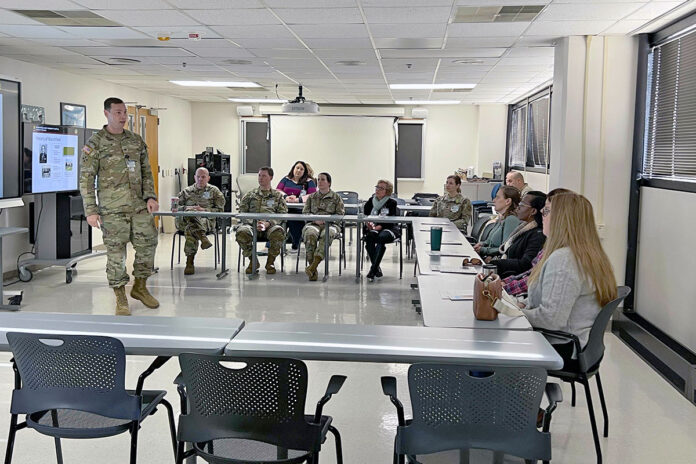 Col. Samuel Preston, Blanchfield Army Community Hospital Commander, addresses senior spouses Dec. 2, 2024, at BACH, Fort Campbell, Kentucky. In his opening remarks, he thanked the spouses for their commitment to Soldier support and resilience. The spouses learned the history and mission of the hospital, then took a tour of the resources available to Soldiers and their Families. (MSG Gina Vaile-Nelson, BACH PAO)